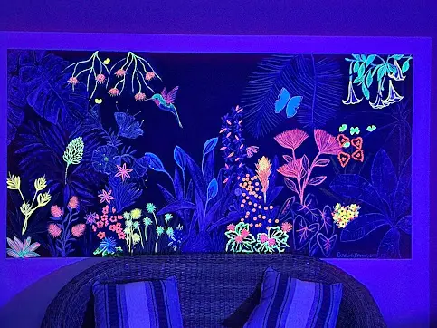 A room with a black light and plants